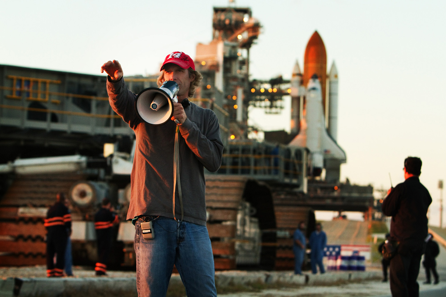 Director, Michael Bay on location with megaphone and space shuttle